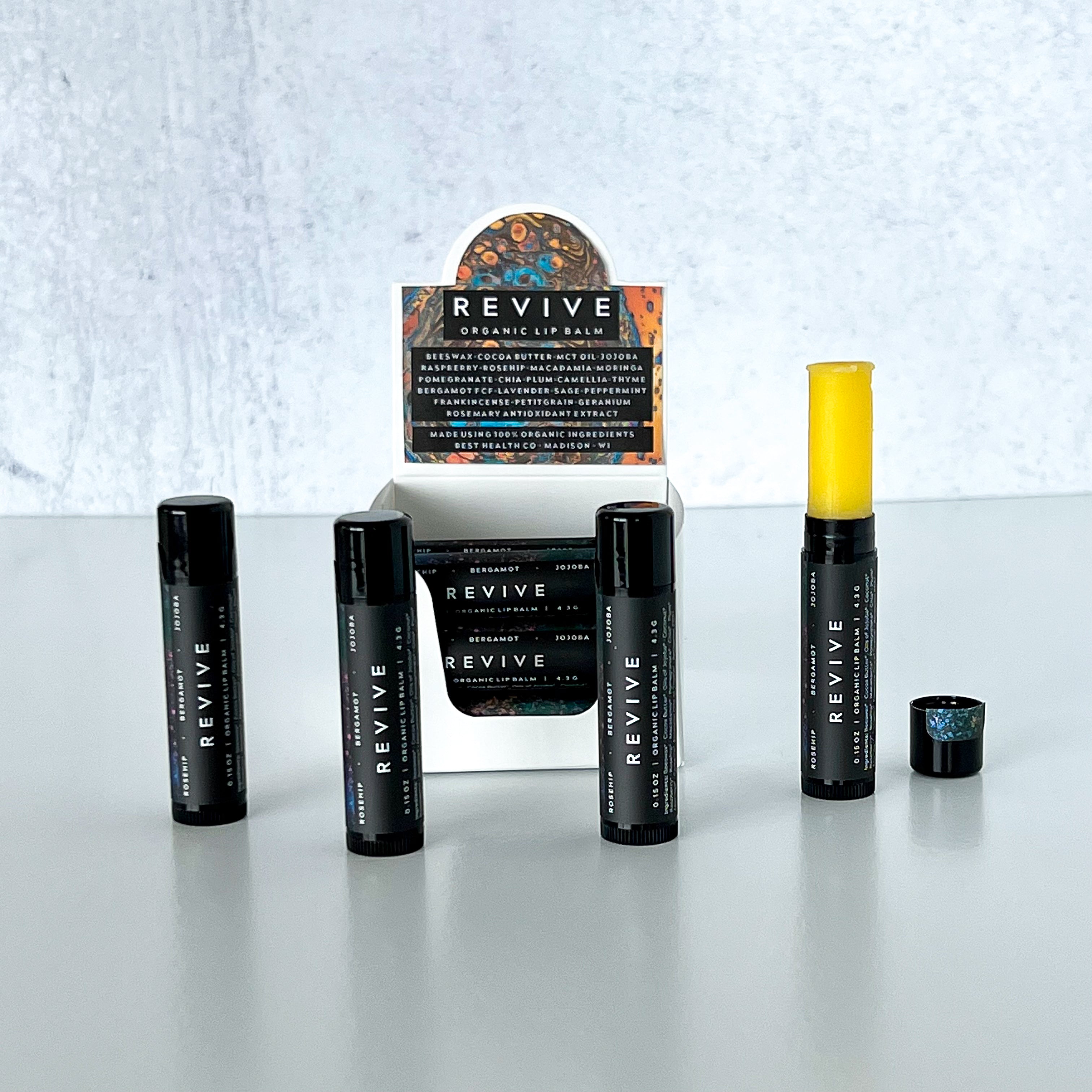 REVIVE Organic Lip Balms with storage container